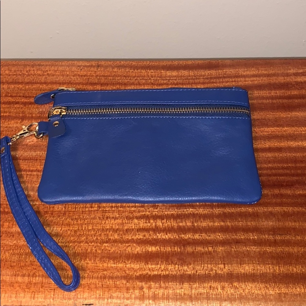 Once used blue leather wristlet